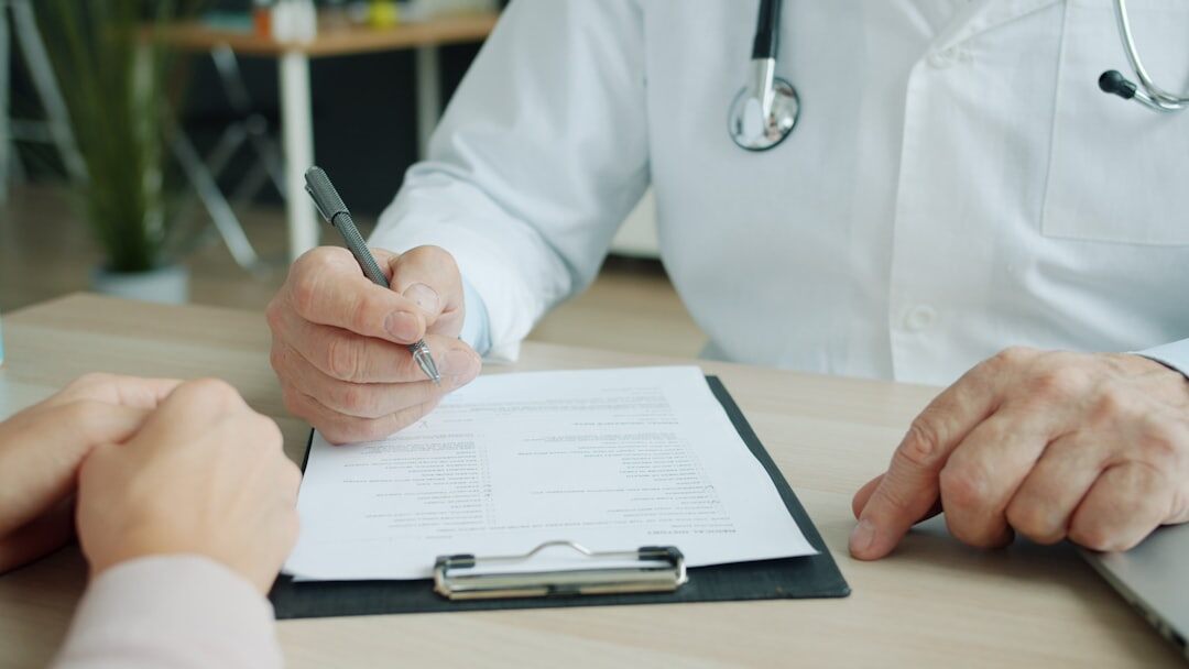 doctor explaining benefits to patient
