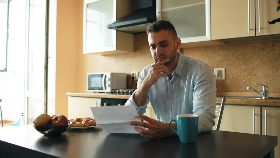 young adult reviewing health insurance documents