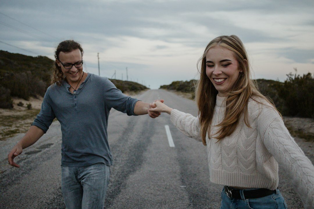 Happy young Singaporean couple smiling together outdoors